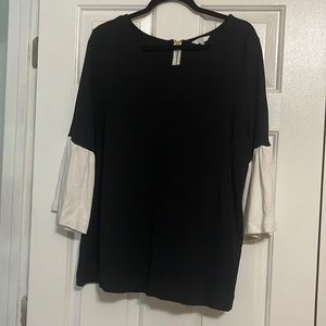 Crown & Ivy black shirt with gold zipper and three quarter ivory sleeves